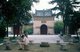 China: A man reads in the courtyard at the Xiaoyan Ta (Little Wild Goose Pagoda), Xi'an, Shaanxi Province